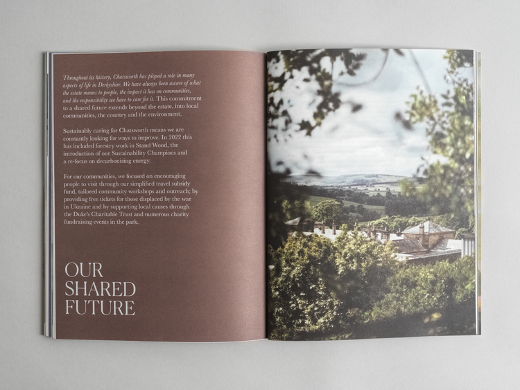 An open copy of the Chatsworth House Trust Annual Review. OUR SHARED FUTURE. A view over the Chatsworth Estate.